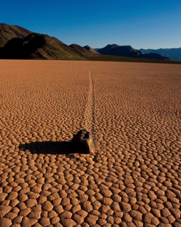 Stone on dried-out earth, Racetrack Valley, Death Valley, California, USA, North America