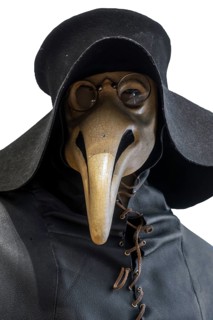 Black wide-brimmed hat, overcoat and beaked mask for plague doctor to treat victims of bubonic