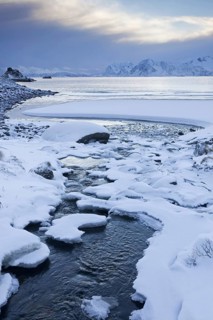 Snow on the beach of Rørvika, Rorvika, Tysfjorden in winter, Austvagoy, Austvågøya, Lofoten,