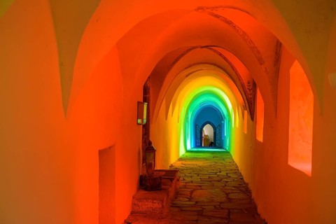 Colourfully illuminated cloister in the Carthusian monastery of Allerengelberg, Schnalstal Valley,