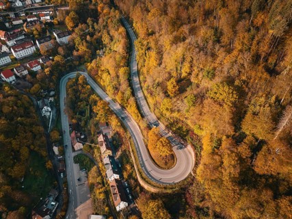 Aerial view S-curve in autumn, Calw, Black Forest Germany