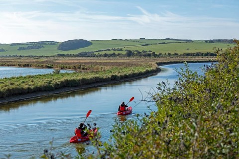 Kayaks on the River Cuckmere, Cuckmere Haven, Seven Sisters, East Sussex, England, Great Britain