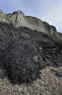 Black Ven landslide on beach between Lyme Regis and Charmouth along the Jurassic Coast, Dorset,