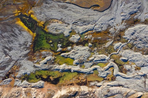 Aerial view over coast at Ekmanfjorden, fjord in the Nordre Isfjorden National Park in summer,