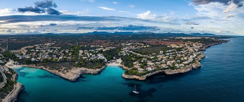 Sunset over Cala Anguila-Cala Mendia from a drone, Porto Cristo, Majorca, Spain, Europe