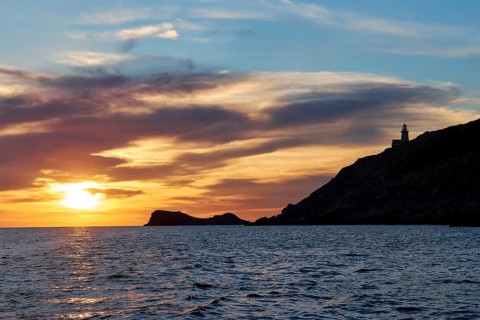 Lighthouse, Faro di Punta Libeccio, sunset, dusk, blue evening sky, grey clouds, Marettimo, Egadi