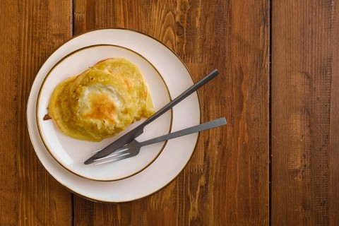 Top view of fried apple pancakes on a plate