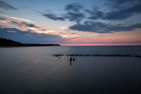 Groynes in front of the Baltic Sea coast at dusk, long exposure, Heringsdorf, Usedom, Germany,