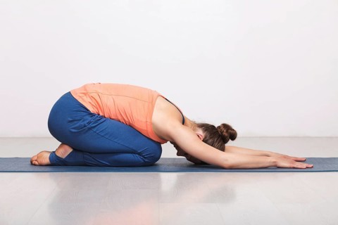 Woman relax in Hatha yoga asana Balasana, child's pose resting position or counter asana for many