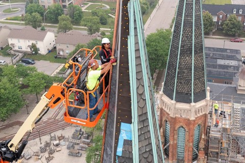 Detroit, Michigan, Workers repair the towers of the Basilica of Ste. Anne de Detroit. Ste. Anne was