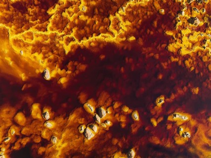 Detail of the Rio Tinto (Red river) with its deep reddish hue due to oxidised iron minerals in its
