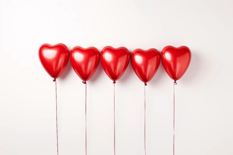 Multiple red heart shaped foil balloons on white background. KI generiert, generiert AI generated