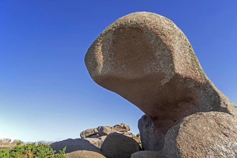 Strange rock formations and water, wind eroded boulders along the Côte de granit rose, Pink Granite