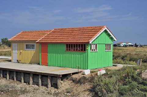 Colourful cabins of oyster farm at la Baudissière near Dolus, Saint-Pierre-d'Oléron on the island