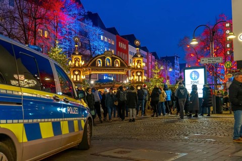Police patrol car in front of the Christmas market on the Alter Markt in the old town of Cologne,