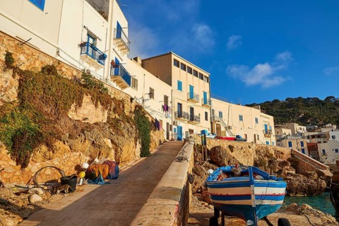 Morning light, row of houses, colourful houses, boat, Levanzo town, main town, Levanzo, Egadi