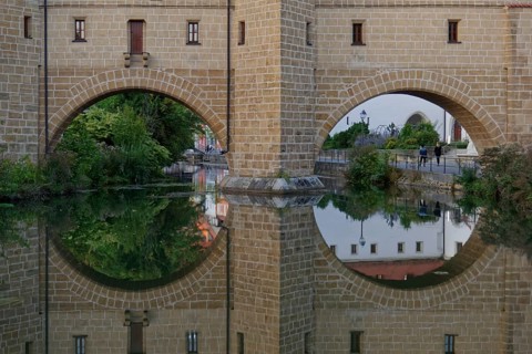 Clear reflection of the fortification wall in the river Vils, Amberg, Upper Palatinate, Bavaria,