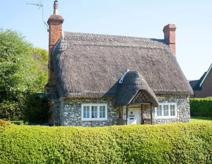 Pretty detached thatch and flint cottage Wilcot village, Wiltshire, England, United Kingdom, Europe