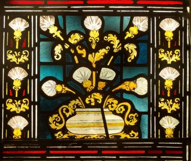 Stained glass window church of Saint John, Saxmundham, Suffolk, England, UK bunch of lilies in bowl