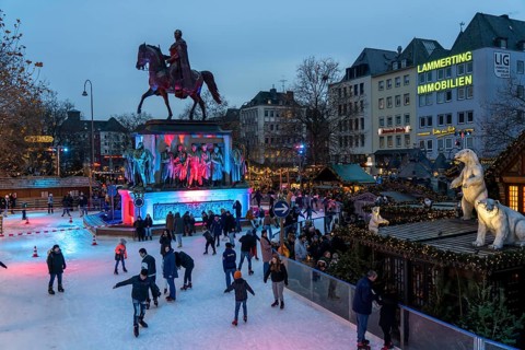 Ice rink at the Christmas market on the Heumarkt in the old town of Cologne, Sunday shopping in