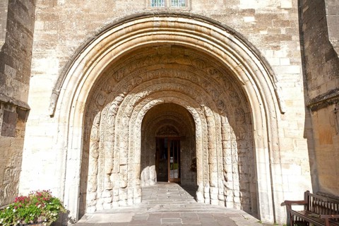 Norman arched door Malmesbury abbey church building, Wiltshire, England, UK
