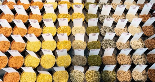 Samples of pulses kept on display inside a shop at a wholesale market ahead of the presentation of