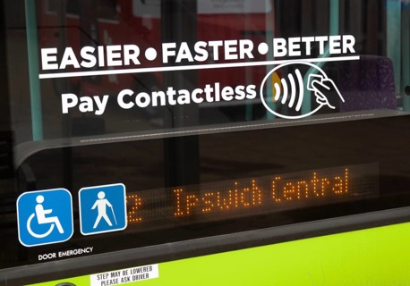 Pay Contactless sign on bus window, Ipswich, Suffolk, England, Uk