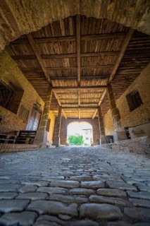 Interior view of a covered bridge with cobblestones and a wooden beam ceiling, Harz Mountains,
