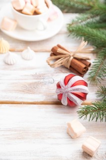 Christmas or New Year composition. Decorations, box, balls, cinnamon, fir and spruce branches, cup