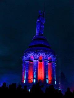 Crowd, silhouettes in front of Hermannsdenkmal, illuminated, night shot, Teutoburg Forest, Detmold,