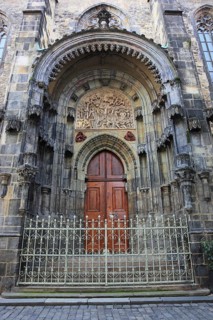 The north portal with tympanum of the Teyn Church, a Roman Catholic church of the Virgin Mary in