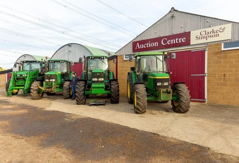 Row of John Deere tractors in farm machinery auction sale, Campsea Ashe, Suffolk, England, UK