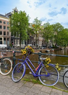 Bicycle on a bridge over Singel canal, Amsterdam, Netherlands