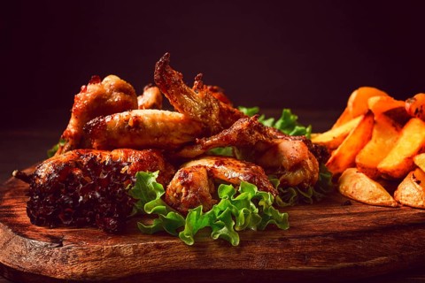 Fried chicken wings, with potatoes, and spices, homemade, fast food, no people