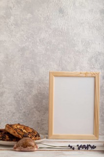 White wooden frame mockup with lavender in ceramic vase, linen textile, cup of coffee and bun on