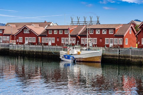 Typical red wooden houses at the harbor, Svolvær, Lofoten, Norway, Europe