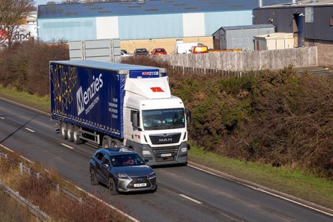 MAN heavy goods vehicle Menzies Distribution, lorry on A12, Martlesham, Suffolk, England, UK