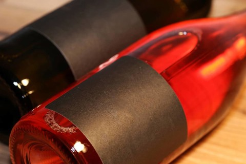 Close-up of two horizontal wine bottles