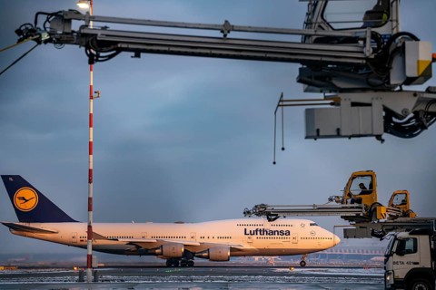 Winter at Frankfurt Main Airport, FRA, de-icing vehicles waiting for aircraft to be de-iced, Hesse,