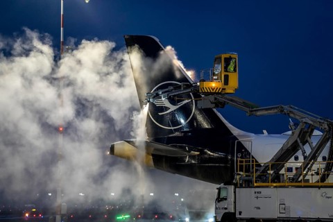 Winter at Frankfurt Main Airport, FRA, Lufthansa aircraft being de-iced by de-icing vehicles,