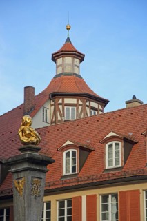 Community centre of St. Gumbertus with monument to Johann Sebastian Bach at the
