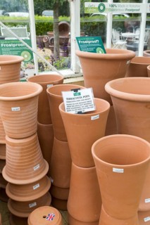 Display of terracotta pots on sale, The Walled garden plant nursery, Benhall, Suffolk, England, UK