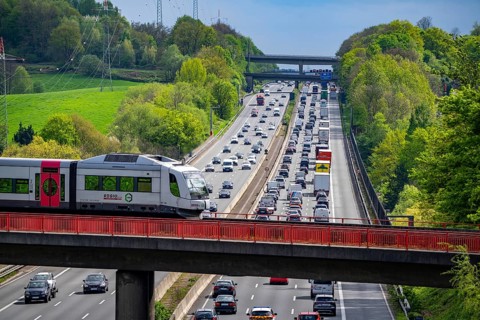 Local train S-Bahn, Regiobahn, S28, crossing the motorway A3, traffic on 8 lanes, incl. the