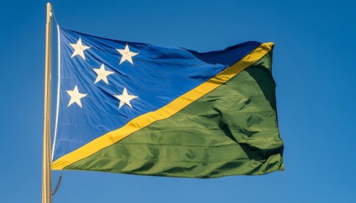 The flag of Solomon Islands, Solomon Islands, island nation in the South Seas, flutters in the