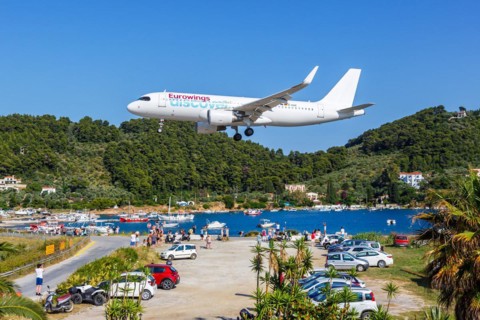 A Eurowings Discover Airbus A320 aircraft with the registration D-AIUZ at Skiathos Airport, Greece,
