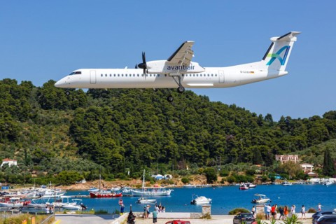 A De Havilland Dash 8 Q400 aircraft of Avanti Air with the registration D-AASH at Skiathos Airport,