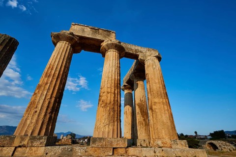 Archaic Temple of Apollo, Doric columns, Ancient row of columns of a temple in the warm sunlight of