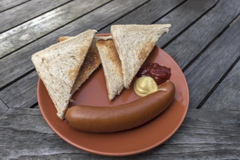 Bockwurst sausage sausage served on a plate with slices of toast, Mecklenburg-Vorpommern, Germany,