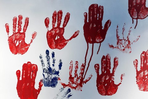 Red handprints on a white wall, Duisburg, North Rhine-Westphalia, Germany, Europe