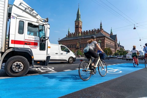 Cyclists on cycle paths, Radhuspladsen, City Hall Square, in the city centre of Copenhagen,
